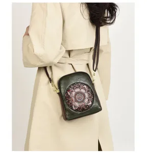 Retro embossed leather cross-body phone bag, stylish women's shoulder bag for daily use.