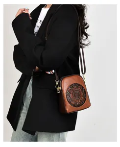Vintage embossed shoulder crossbody phone bag for women, stylish brown retro tooling design.