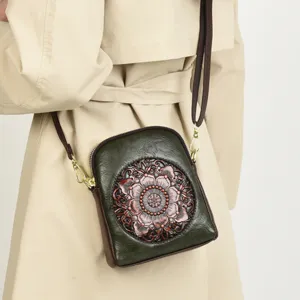 Retro embossed leather crossbody bag, small vintage floral shoulder phone bag for daily use.