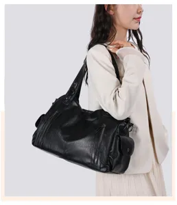 Detailed view of women's black PU leather shoulder bag, casual large capacity tote bag.