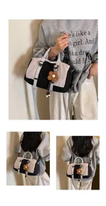 Grande borsa da viaggio con ciondolo a fiore, elegante design bicolore per viaggi e tempo libero.