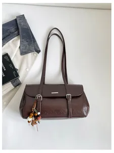 Retro brown shoulder bag underarm bag with double straps, metal bar and beaded tassel charm.