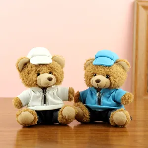 Plush teddy bear toy details featuring cute caps and jackets, perfect car interior decoration.