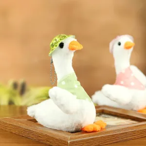 Cute plush duck toy stuffed goose doll with cute green hat and lovely polka dot bib for kids.