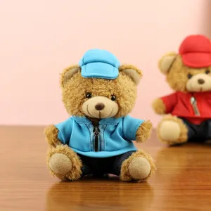 Plush teddy bear toy wearing blue hoodie and cap, cute car decoration and keychain pendant.