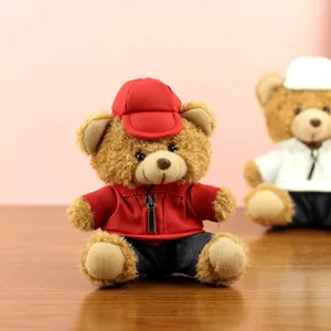 Cute plush teddy bear toy pendant wearing a red jacket and cap, perfect for car decoration.