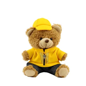 Cute plush teddy bear toy wearing yellow jacket and hat, perfect car decoration and gift item.
