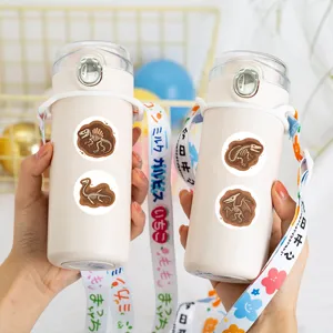 Children's portable insulated thermos water bottle with dinosaur fossil stickers and strap.