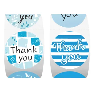 Closeup of blue thank you roll stickers with lovely striped and leaf patterns for gift sealing.