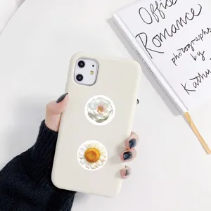 Decorative floral phone case stickers with beautiful peony and daisy designs for DIY crafts.