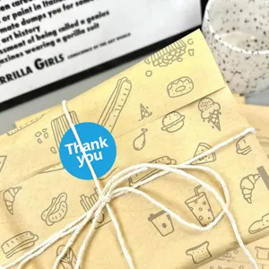 Blue thank you sticker detail shot, round decorative seal label for gift wrapping and packaging.
