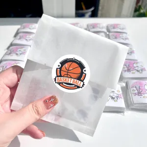 Close-up of cute basketball round stickers in semi-transparent paper bag packaging.
