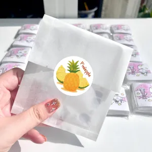 Close-up detail of cute fruit sticker packaging, colorful design, ideal for kids reward crafts.
