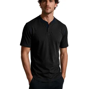 Detail view of a men's short sleeve Henley t-shirt in dark gray with contrast blue stitching.