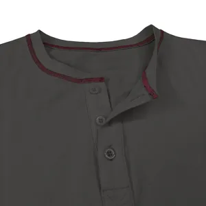 Close-up detail of dark grey men's long sleeve henley shirt with red contrast stitching.