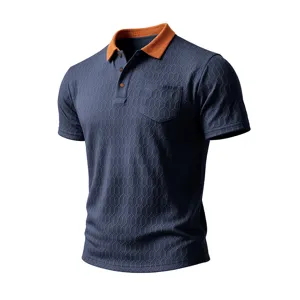 Textured short sleeve polo shirt detail, navy blue fabric with honeycomb pattern, orange collar.
