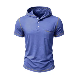 Close-up detail of mens short sleeve hooded henley shirt with contrast stitching and pocket.