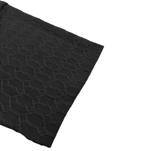 Close-up detail of black men summer short sleeve polo shirt geometric knit fabric texture