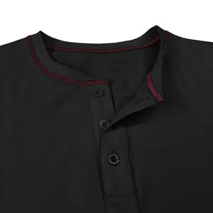Close-up detail of the black mens henley shirt collar, featuring contrast red stitching and buttons.