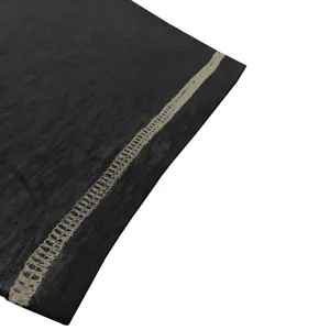 Detail shot of men's vintage short sleeve t-shirt dark fabric contrast stitching texture.