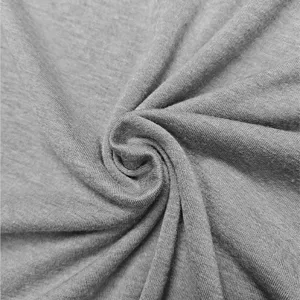 Grey fabric texture detail, soft knit material close up for apparel manufacturing.