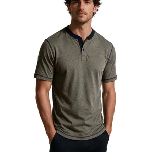 Detail view of men's short sleeve heather green Henley t-shirt with navy contrast trim.