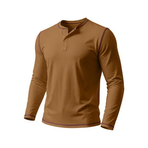 Close-up view of a brown men's long sleeve Henley shirt featuring contrast stitching details.