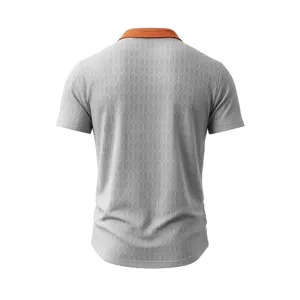 Detail view of men's grey short sleeve polo shirt with orange collar and geometric jacquard design.