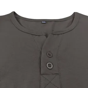 Close-up detail view showing the neckline and button placket of men's short sleeve Henley shirt.