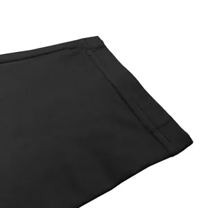 Close-up detail showing the fine fabric and stitching texture of black long sleeve shirt.