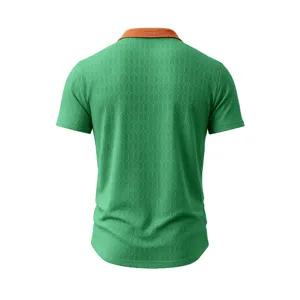 Detailed view of the green men's short-sleeve polo shirt with distinct textured geometric weave.