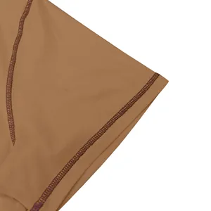 Close-up detail of men summer t-shirt fabric and neat brown seam stitching quality.