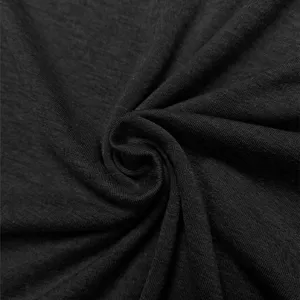 Close-up detail shot of dark grey knitted fabric texture, soft and breathable material.