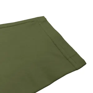 Detail view of men's solid army green long sleeve shirt cuff, neat double-needle stitching