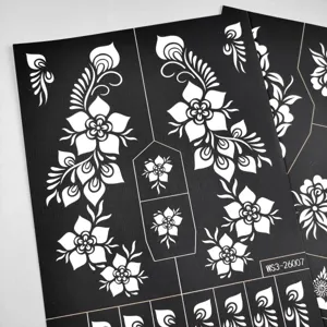 Detailed close-up view of hollow floral vine henna tattoo stencil sticker sheet design.