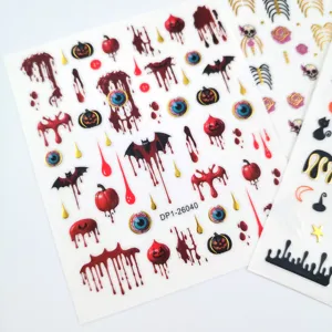 Autocollants d'ongles d'Halloween avec du sang effrayant, des citrouilles et des yeux pour nail art.