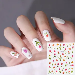 Vista detallada de pegatinas de uñas de tulipanes coloridos en uñas postizas, diseño.