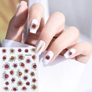 Adhesivos de uñas con flores bonitas y margaritas coloridas para una manicura elegante.