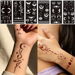 Close-up details of reusable henna tattoo stencils with moon and star pattern designs.