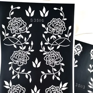 Detailed view of disposable hollow rose floral henna tattoo stencil template for body art.