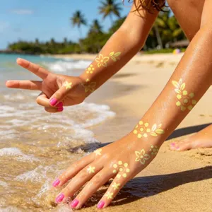 Detail shot of holographic temporary tattoo stickers showing flower designs on arms for beach use.
