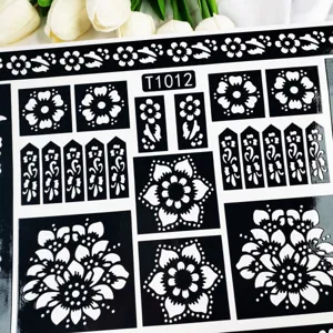 Henna tattoo stencil sheet featuring black and white floral and mandala hollow patterns for DIY art.