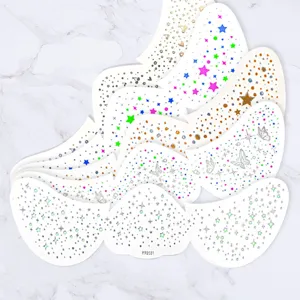 Close-up detail of colorful butterfly and star glitter face stickers, perfect for party makeup.