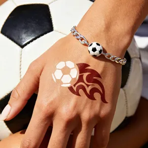 Football theme metal chain bracelet and temporary tattoo hand sticker detail view