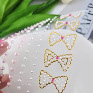 Pearl bow face jewels detail shot, adhesive makeup gems for festival party stage looks.