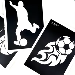 Black hollow tattoo stencil set featuring soccer player and flaming ball patterns for cool body art.