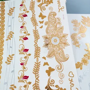 Metallic gold silver henna temporary tattoo sticker detail view, elegant floral paisley design.