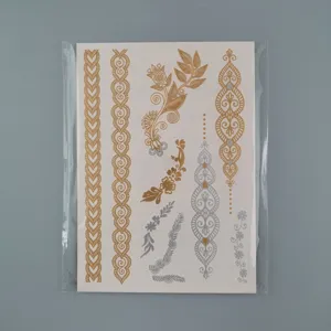 Detailed close-up view of gold and silver metallic temporary henna tattoo stickers sheet.