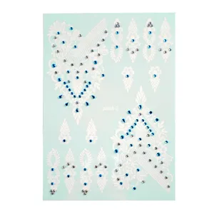 White henna lace temporary body tattoo sticker with blue and silver rhinestones for party.