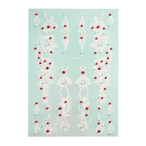White henna temporary tattoo sticker sheet with red and white rhinestones for face and body.